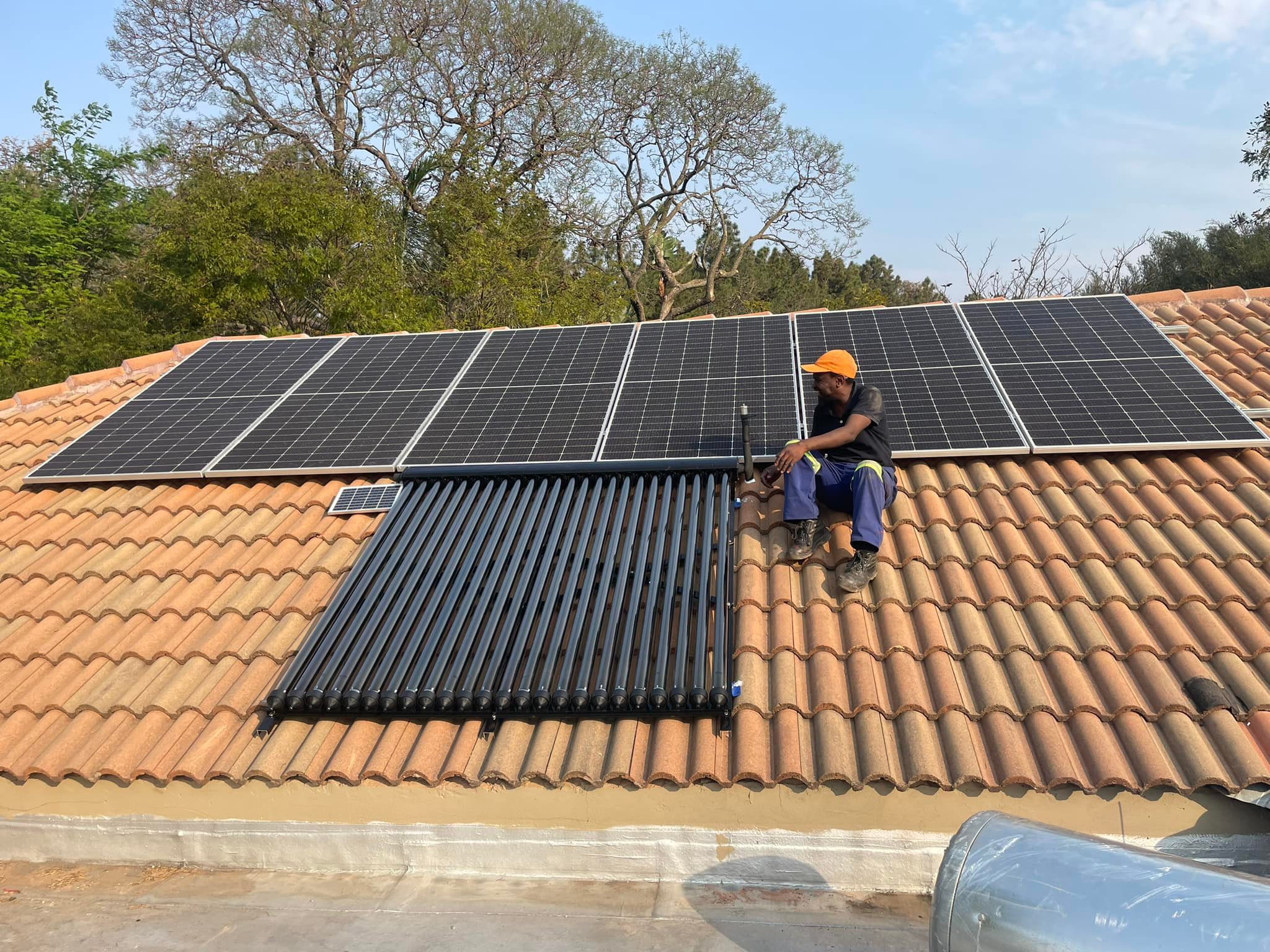 Professional solar panel and water heater installation by Quattro-LT1 technician